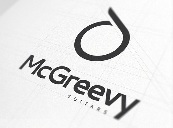 Brand Name and logo against white paper - McGreevy Guitars